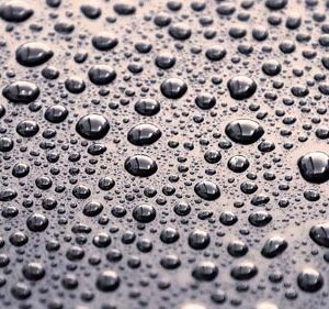 water droplets beaded on car